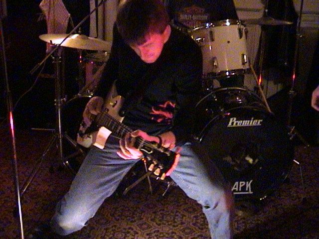 Gary tries a Poodle Rock pose without aid of permed hair.